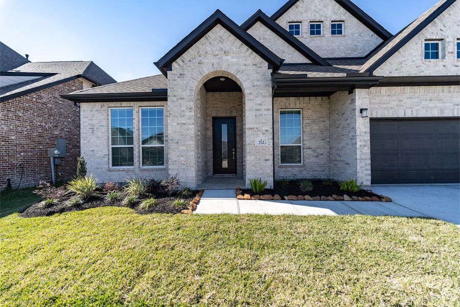 Front exterior of a new home in Westwood, League City, TX, highlighting curb appeal (Image 2).