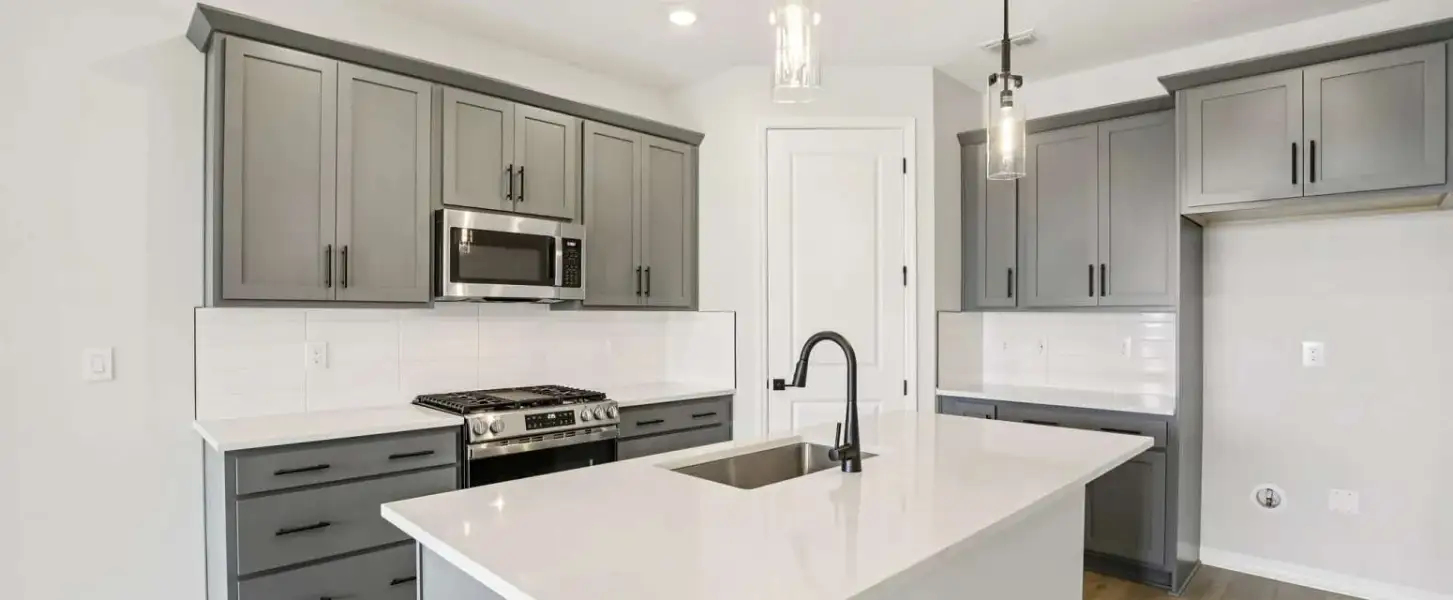 Kitchen with ample cabinets for storage will feature the AW Collection® Coastal - Representative images and renderings are for illustrative purposes. Actual structural options and design finishes of home may vary.