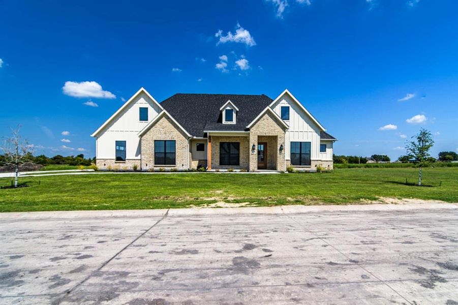 Front exterior of a new home in , Caddo Mills, TX, highlighting curb appeal (Image 1). Front exterior of a new home in , Caddo Mills, TX, highlighting curb appeal (Image 1).