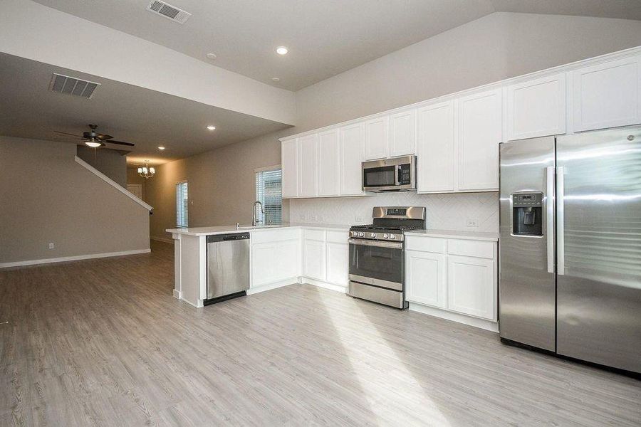 Furnished interior view inside a new home in Marvida, Cypress (Image 11).