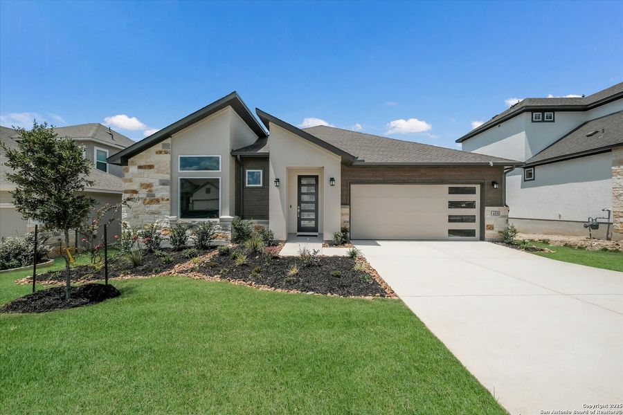 Front exterior of a new home in Esperanza, Boerne, TX, highlighting curb appeal (Image 24).