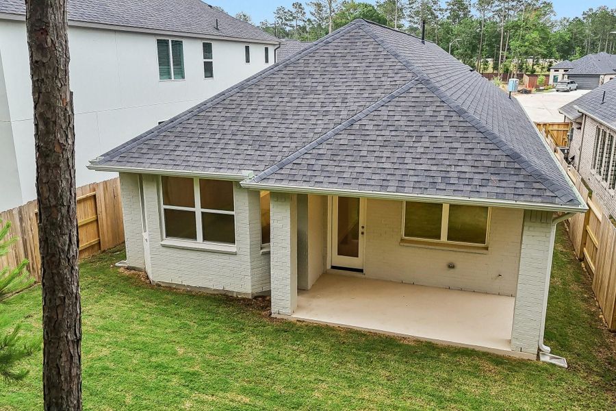 Exterior details and patio area of a home in Woodhavyn 40', Magnolia (Image 19). Exterior details and patio area of a home in Woodhavyn 40', Magnolia (Image 19).