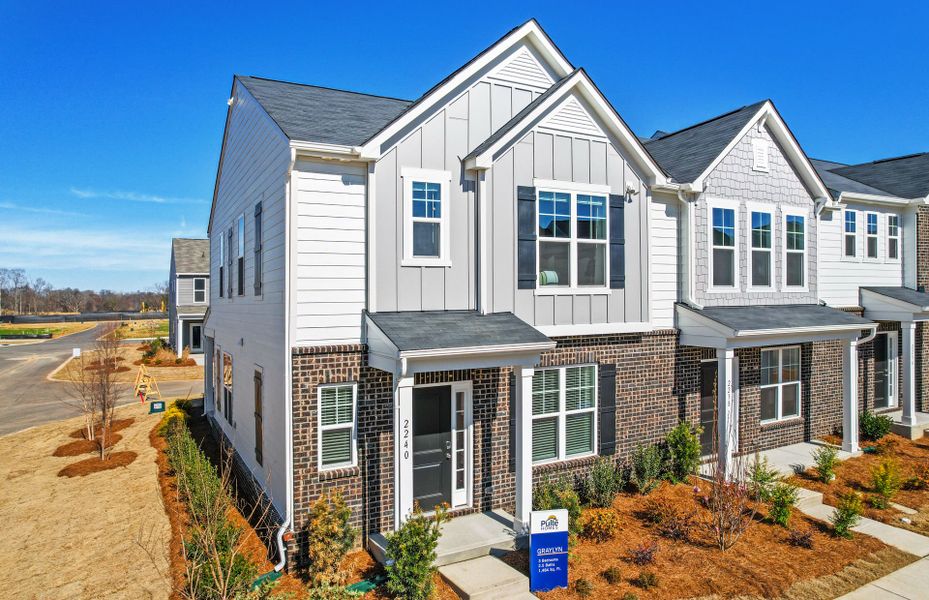 Front exterior of a new home in Riverstone, Monroe, NC, highlighting curb appeal (Image 23).