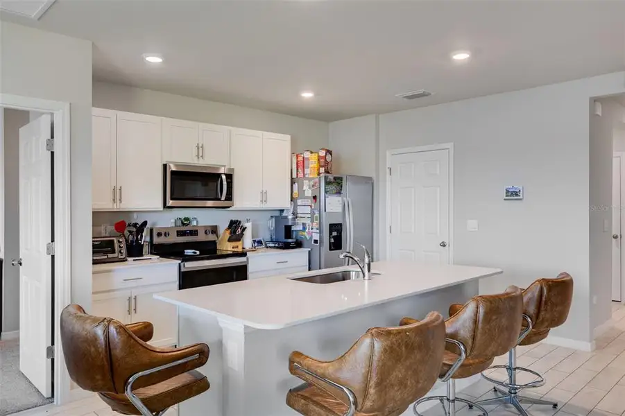 Furnished interior view inside a new home in Coral Bay - Express & Tradition, North Fort Myers (Image 5).