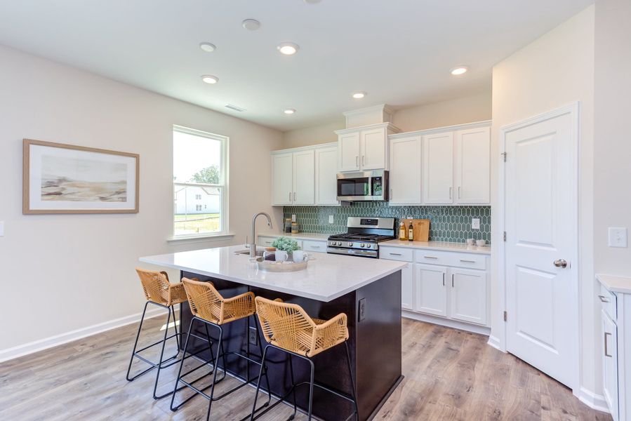 Representative furnished interior of a home built from the The Poppy by Chesapeake Homes in The Willows, Loris (Image 13).
