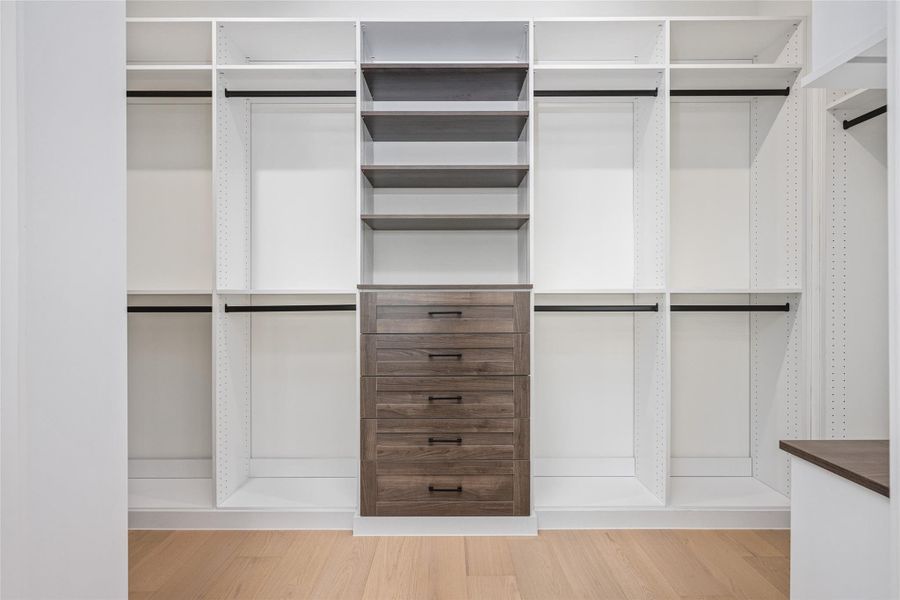 Luxurious features come standard here—highlighted by a custom-designed walk-in closet with a lit vanity mirror for everyday elegance