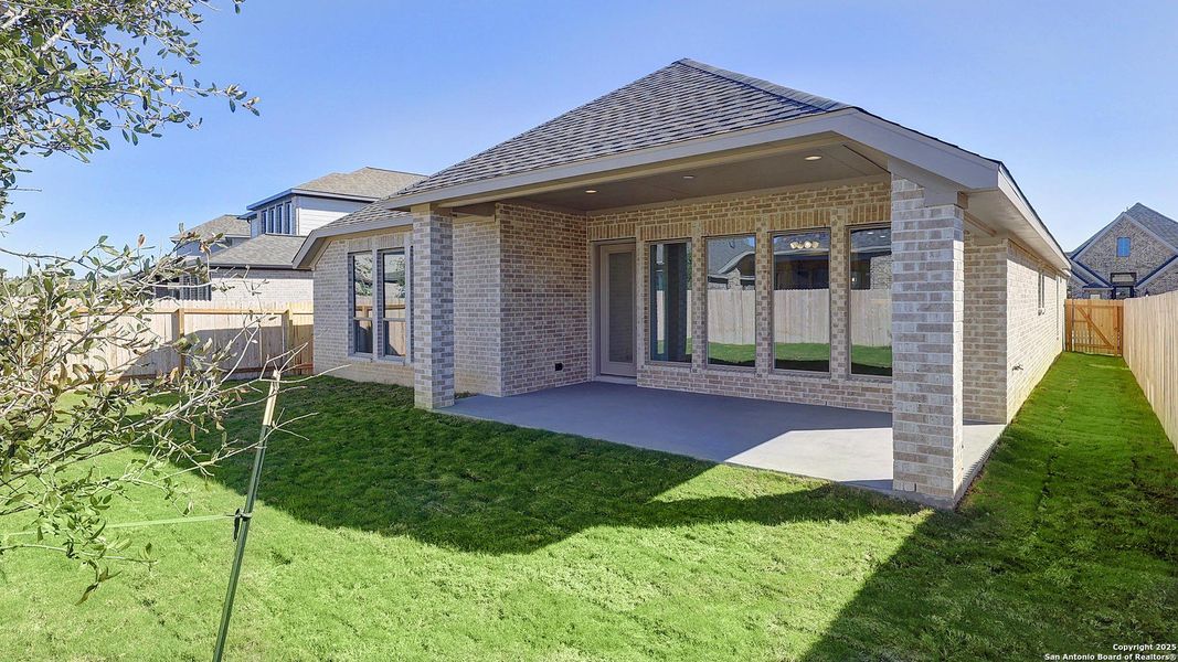 Exterior details and patio area of a home in Kallison Ranch 50', San Antonio (Image 28).