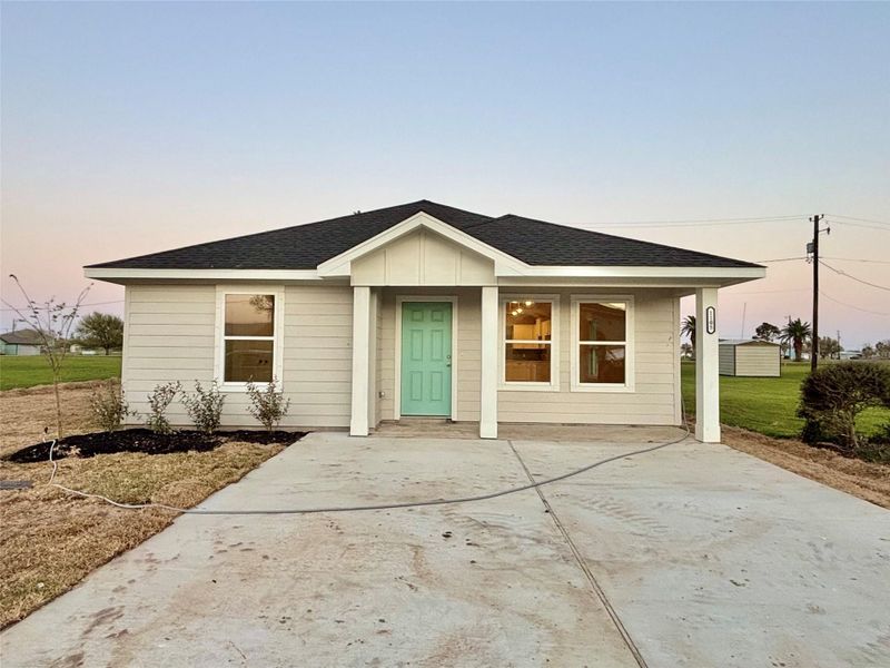 Front exterior of a new home in , Palacios, TX, highlighting curb appeal (Image 15). Front exterior of a new home in , Palacios, TX, highlighting curb appeal (Image 15).