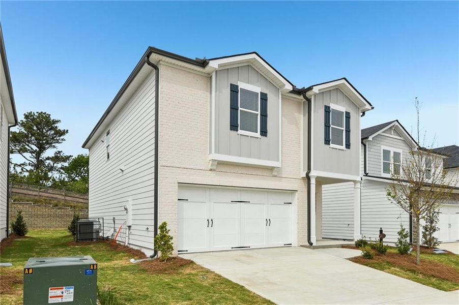 Front exterior of a new home in Hawthorne Station, College Park, GA, highlighting curb appeal (Image 1). Front exterior of a new home in Hawthorne Station, College Park, GA, highlighting curb appeal (Image 1).