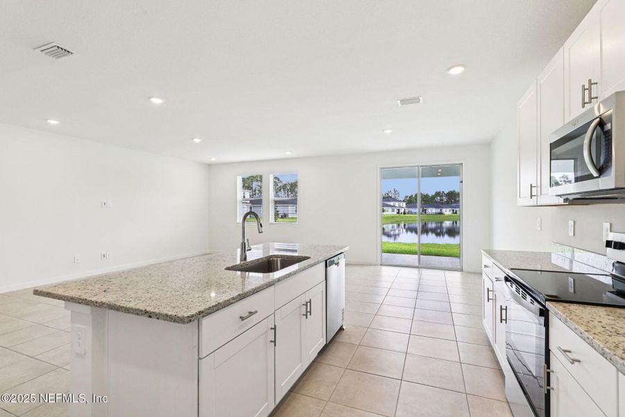 Furnished interior view inside a new home in Lakes at Bella Lago - Signature Series, Green Cove Springs (Image 7).