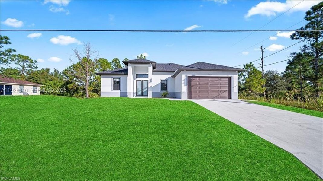 Front exterior of a new home in , Lehigh Acres, FL, highlighting curb appeal (Image 18).