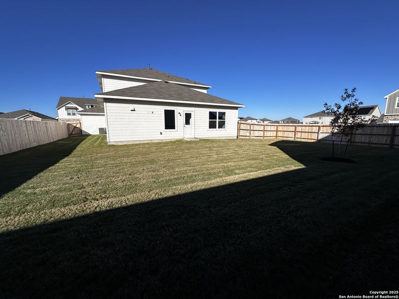 Exterior details and patio area of a home in Hennersby Hollow, San Antonio (Image 3).
