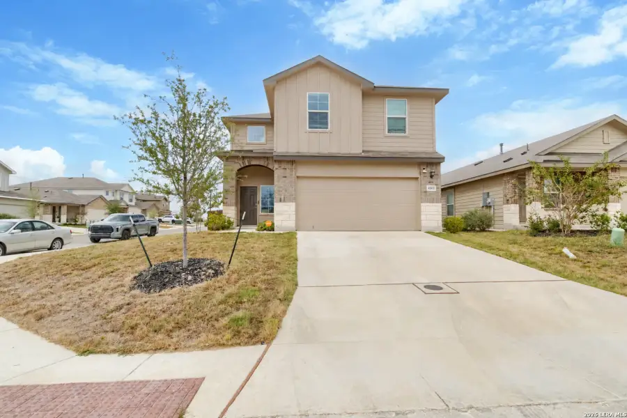 Front exterior of a new home in Avenida, Converse, TX, highlighting curb appeal (Image 23).
