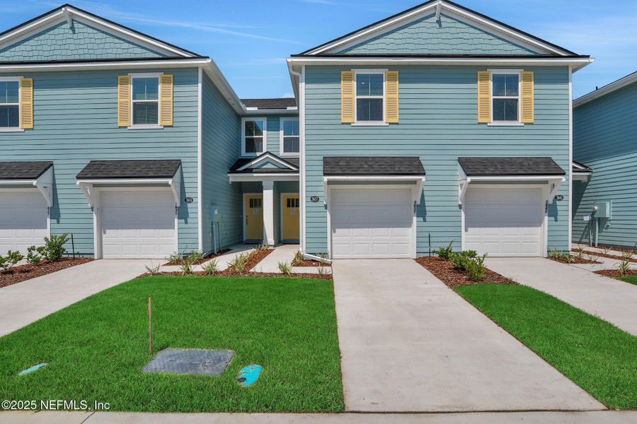 Front exterior of a new home in , Middleburg, FL, highlighting curb appeal (Image 1). Front exterior of a new home in , Middleburg, FL, highlighting curb appeal (Image 1).