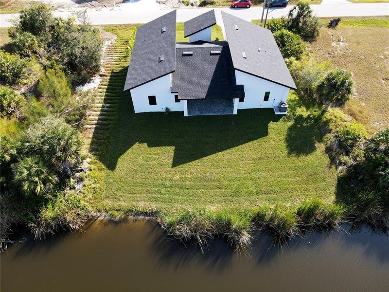 Front exterior of a new home in , Port Charlotte, FL, highlighting curb appeal (Image 25). Front exterior of a new home in , Port Charlotte, FL, highlighting curb appeal (Image 25).
