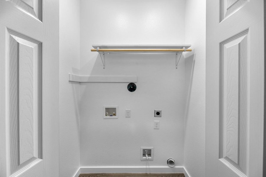 Washer and dryer in the hallway.