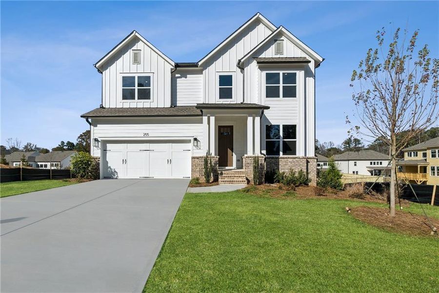 Front exterior of a new home in Havencroft, Woodstock, GA, highlighting curb appeal (Image 1). Front exterior of a new home in Havencroft, Woodstock, GA, highlighting curb appeal (Image 1).