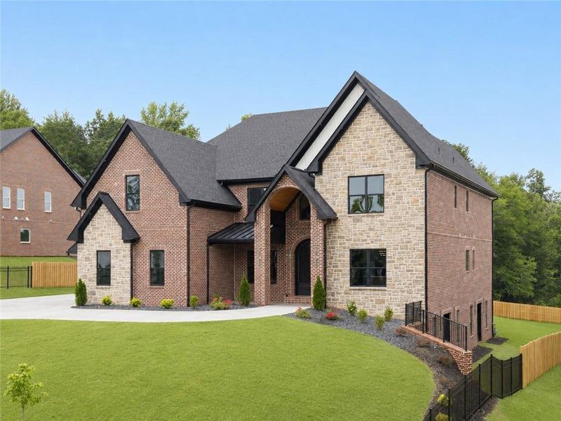 Front exterior of a new home in , Buford, GA, highlighting curb appeal (Image 36). Front exterior of a new home in , Buford, GA, highlighting curb appeal (Image 36).