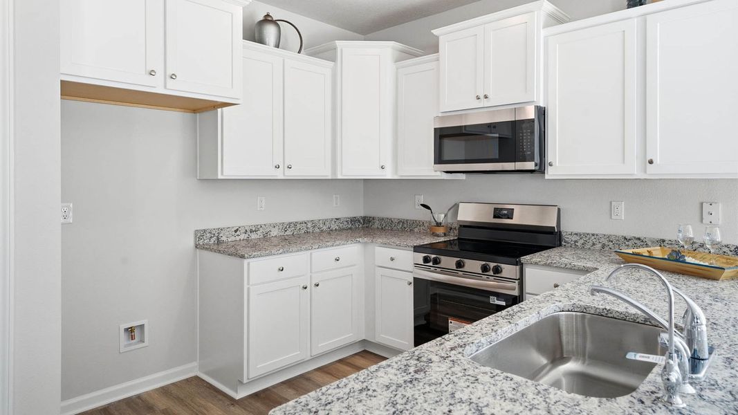 Representative furnished interior of a home built from the The Monroe by D.R. Horton in Chateau Nemours, Port Saint Joe (Image 10).