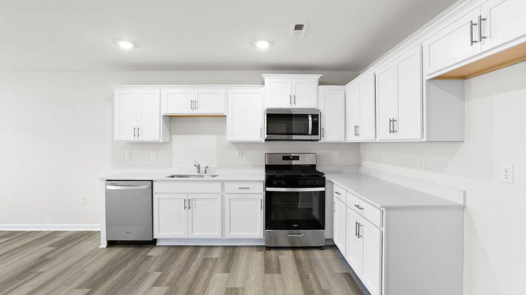 Furnished interior view inside a new home in Village Grove, Greenville (Image 6).