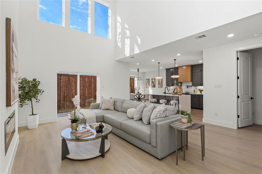 Living area featuring recessed lighting and light wood-style floors