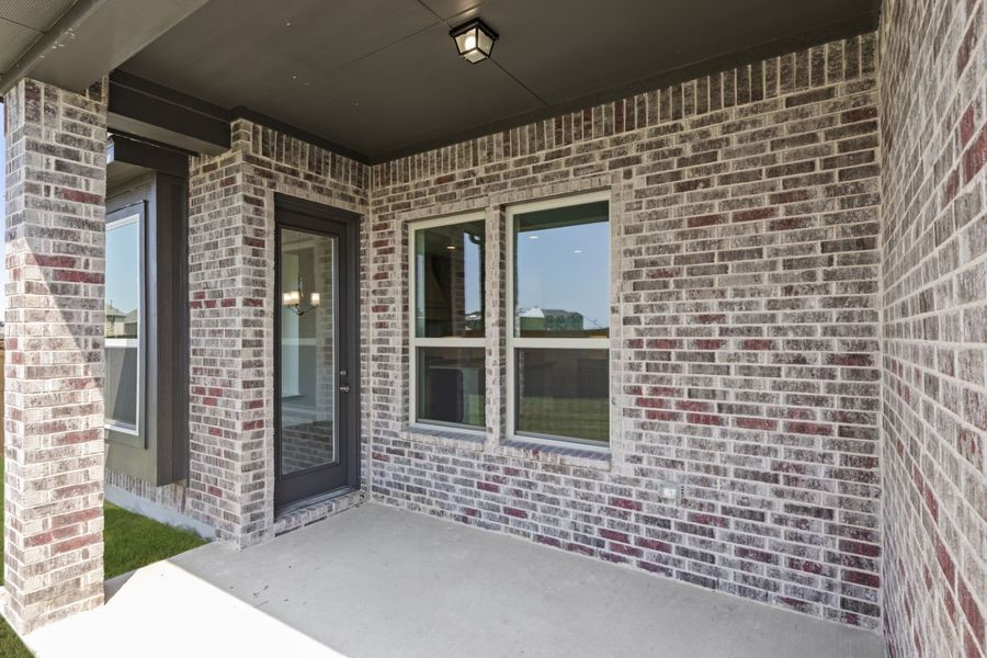 Exterior details and patio area of a home in Anna Town Square, Anna (Image 3).