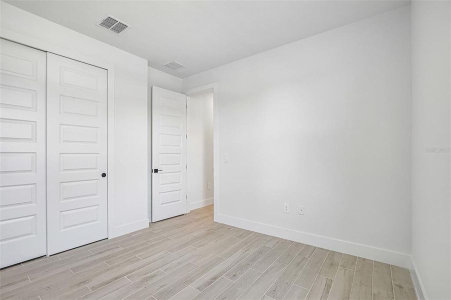 Spacious, unfurnished interior of a new home in Magnolia Bay - Reserve Series, Nokomis (Image 18).