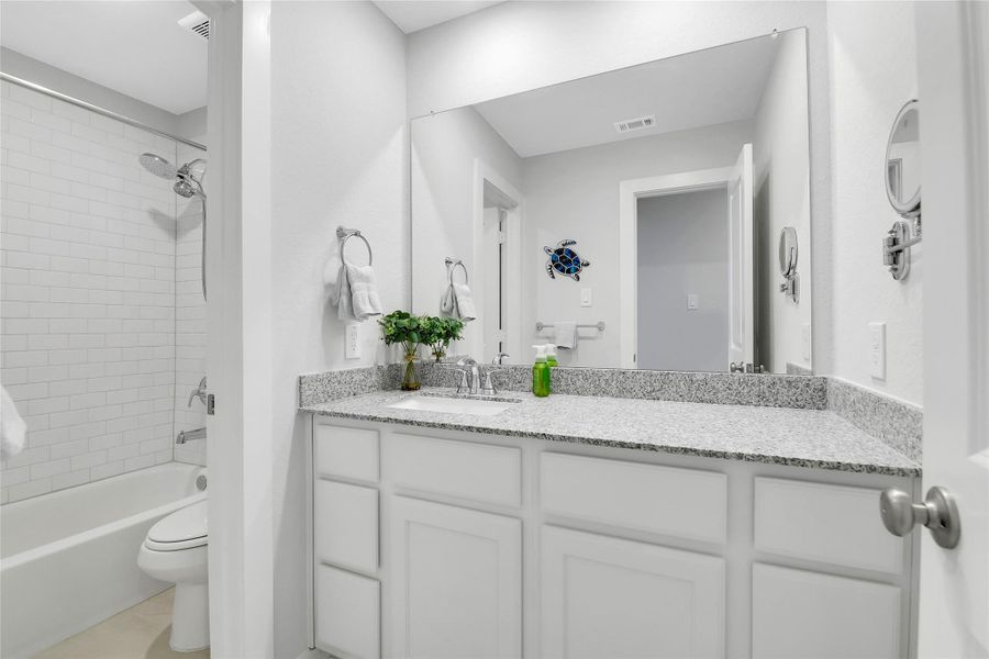 Granite vanity with undermount sink.