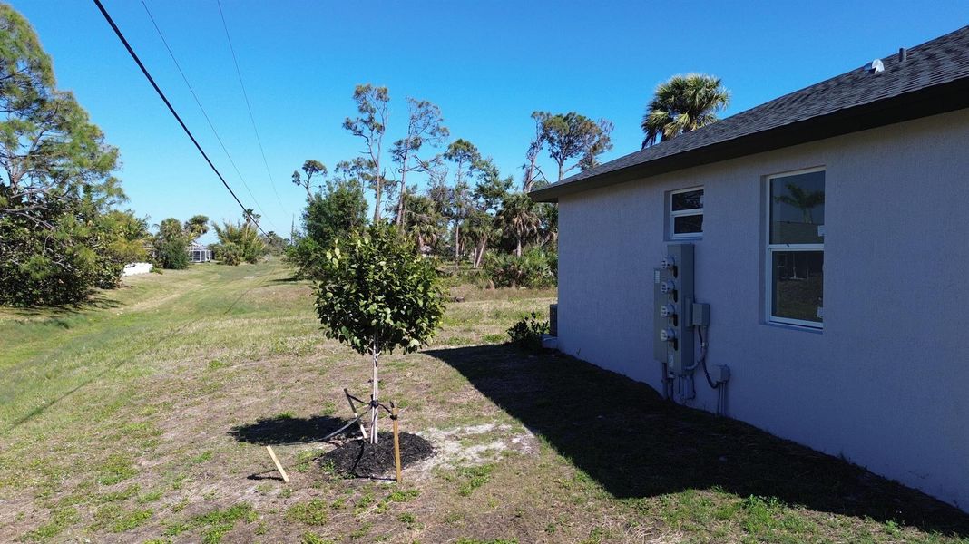 Front exterior of a new home in , Rotonda West, FL, highlighting curb appeal (Image 26).