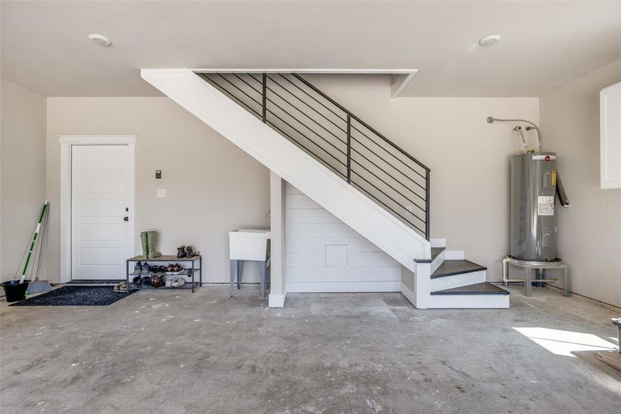 Garage featuring electric water heater