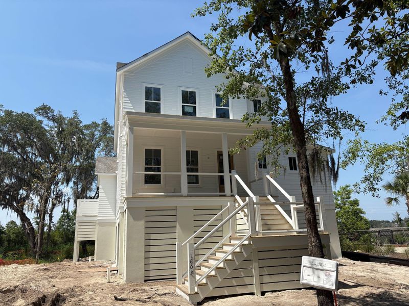 Front exterior of a new home in The Preserve at Pennys Creek, Johns Island, SC, highlighting curb appeal (Image 1).