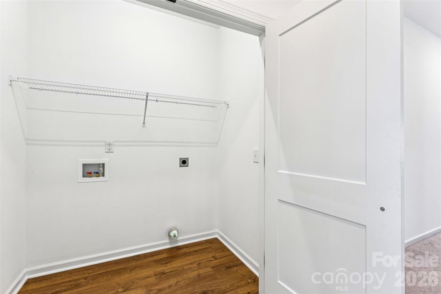 Laundry off of hallway upstairs