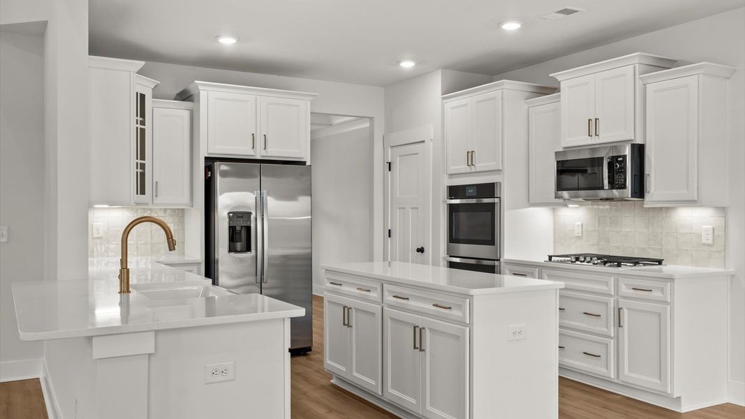 First-class finishes and a thoughtfully scaled island highlight this elegant kitchen space First-class finishes and a thoughtfully scaled island highlight this elegant kitchen space