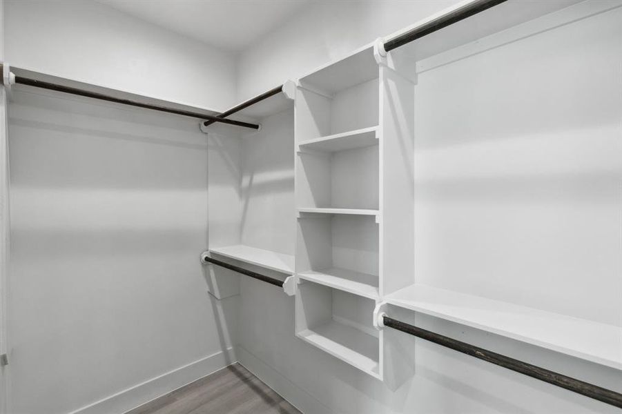 Walk in closet featuring hardwood / wood-style floors