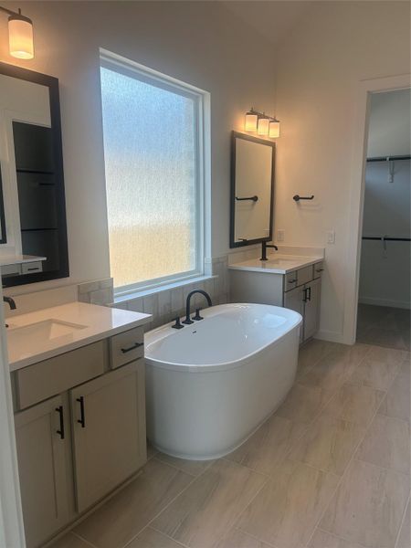Primary Bath retreat with dual vanities and soaking tub