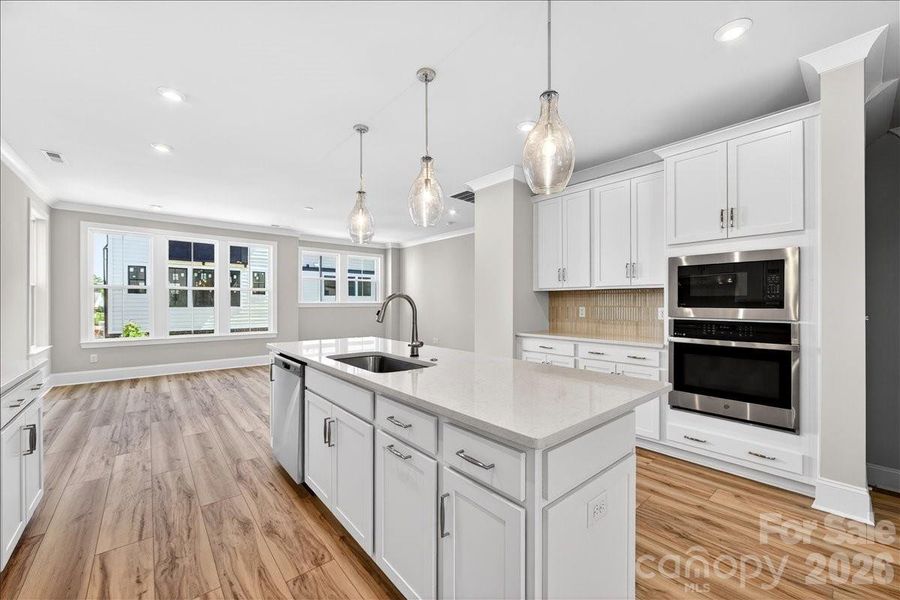 Gourmet Kitchen with white cabinets and white quartz countertops
