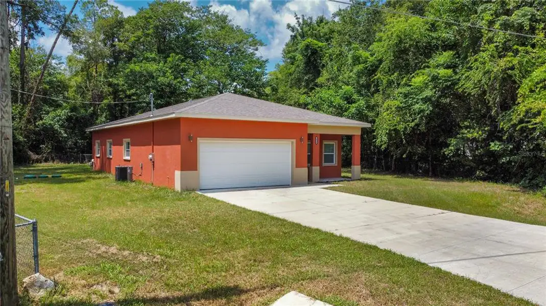 Front exterior of a new home in , Gainesville, FL, highlighting curb appeal (Image 12).