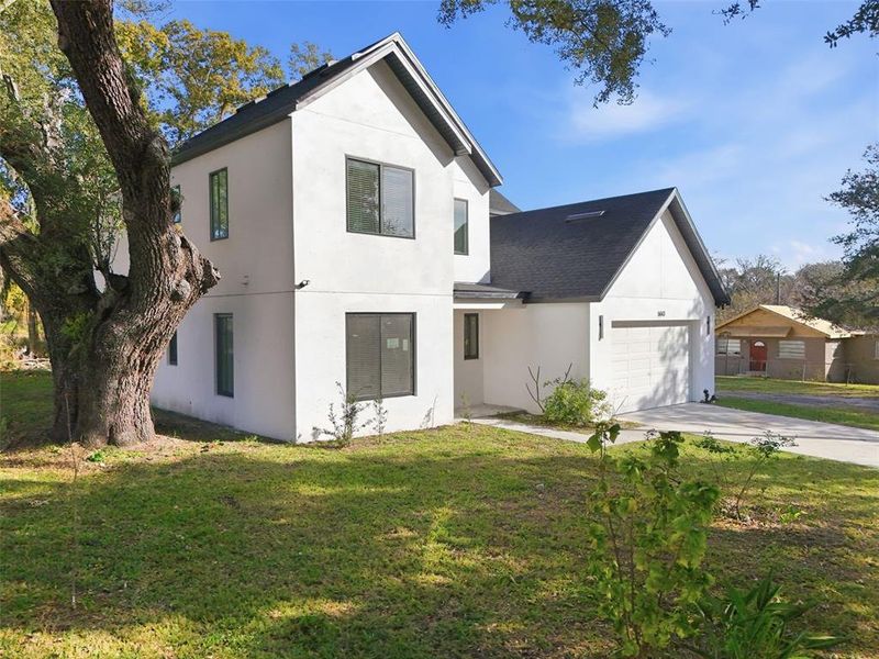 Front exterior of a new home in , Orlando, FL, highlighting curb appeal (Image 23). Front exterior of a new home in , Orlando, FL, highlighting curb appeal (Image 23).
