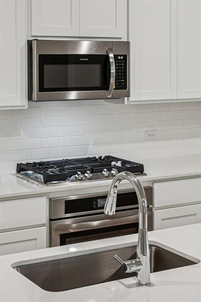 Kitchen in the Oscar home plan by Trophy Signature Homes – REPRESENTATIVE PHOTO Kitchen in the Oscar home plan by Trophy Signature Homes – REPRESENTATIVE PHOTO