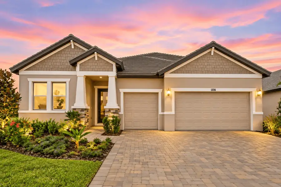 Front exterior of a new home in River Preserve Estates, Parrish, FL, highlighting curb appeal (Image 1). Front exterior of a new home in River Preserve Estates, Parrish, FL, highlighting curb appeal (Image 1).