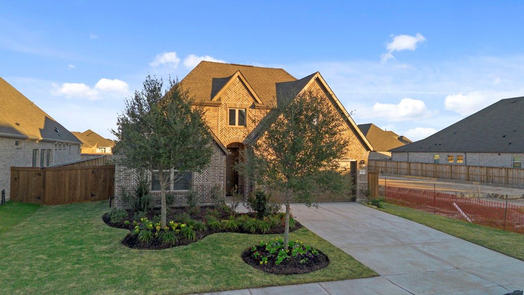Front exterior of a new home in Dunham Pointe, Cypress, TX, highlighting curb appeal (Image 22).