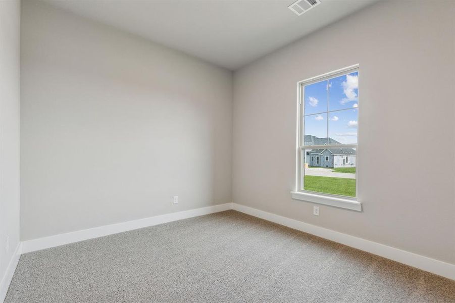 Unfurnished room with carpet flooring