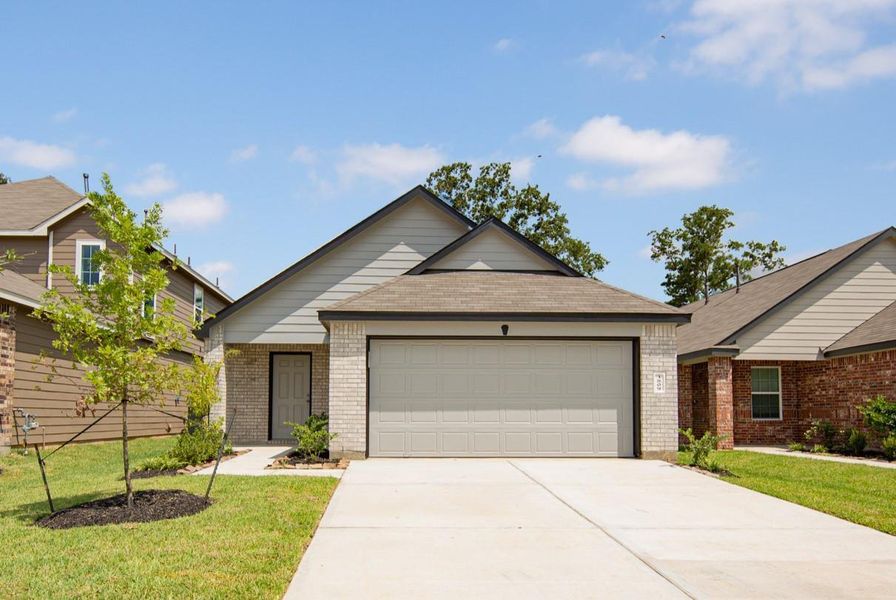 Front exterior of a new home in Mackenzie Creek, Conroe, TX, highlighting curb appeal (Image 1). Front exterior of a new home in Mackenzie Creek, Conroe, TX, highlighting curb appeal (Image 1).
