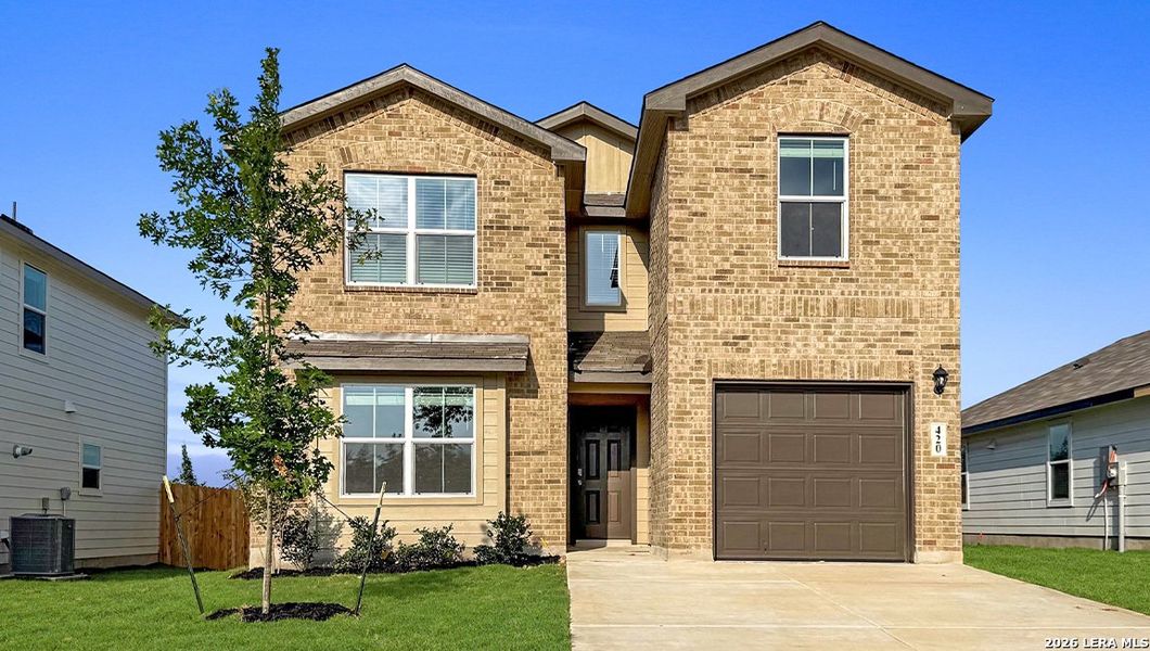 Front exterior of a new home in Redbird Ranch, San Antonio, TX, highlighting curb appeal (Image 2).