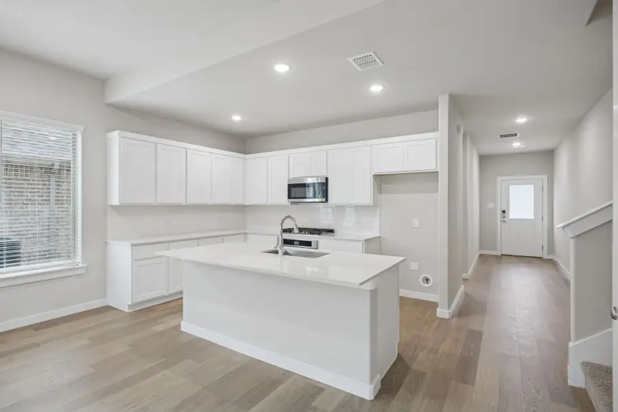 Kitchen in the Stanley II home plan by Trophy Signature Homes – REPRESENTATIVE PHOTO Kitchen in the Stanley II home plan by Trophy Signature Homes – REPRESENTATIVE PHOTO