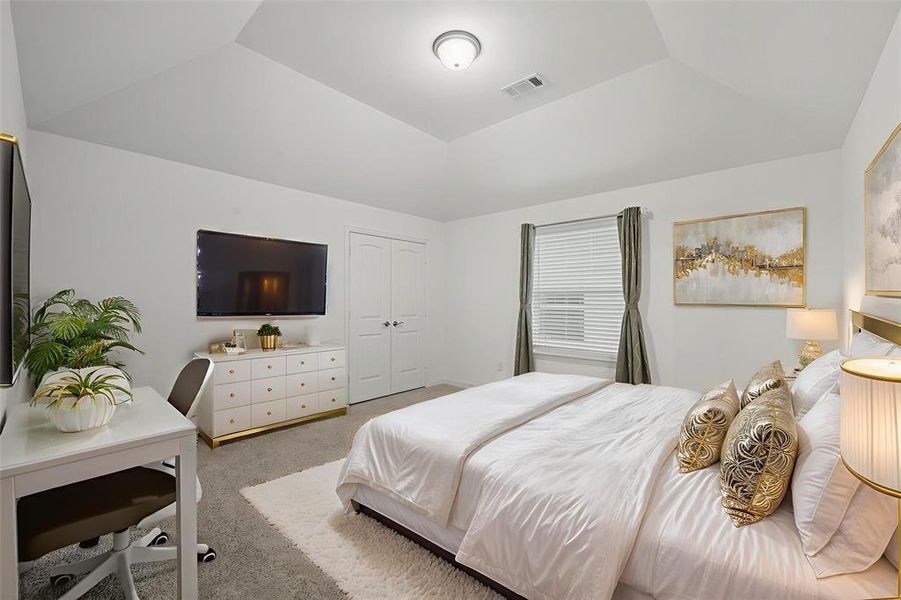 Bedroom with light colored carpet and a closet Bedroom with light colored carpet and a closet