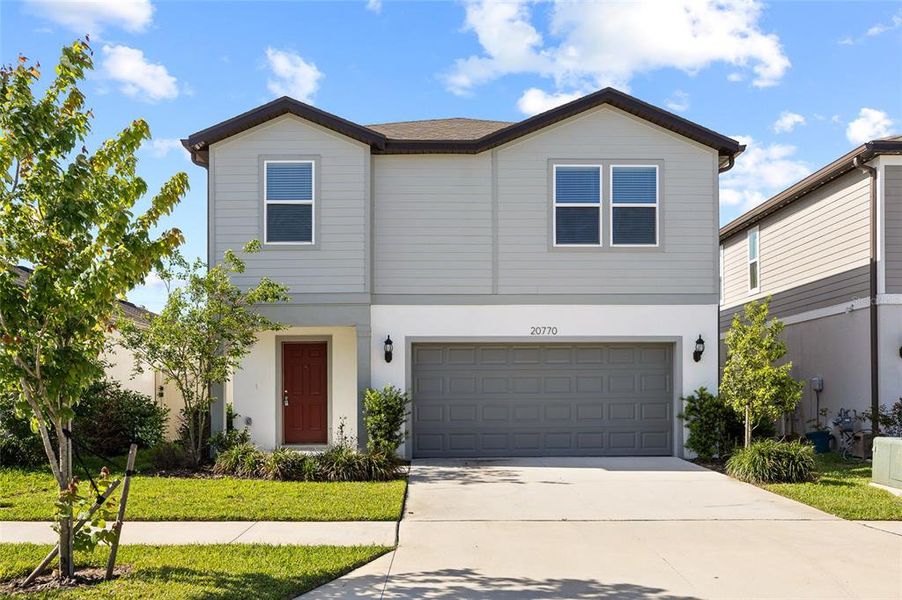 Front exterior of a new home in , Land O' Lakes, FL, highlighting curb appeal (Image 29).