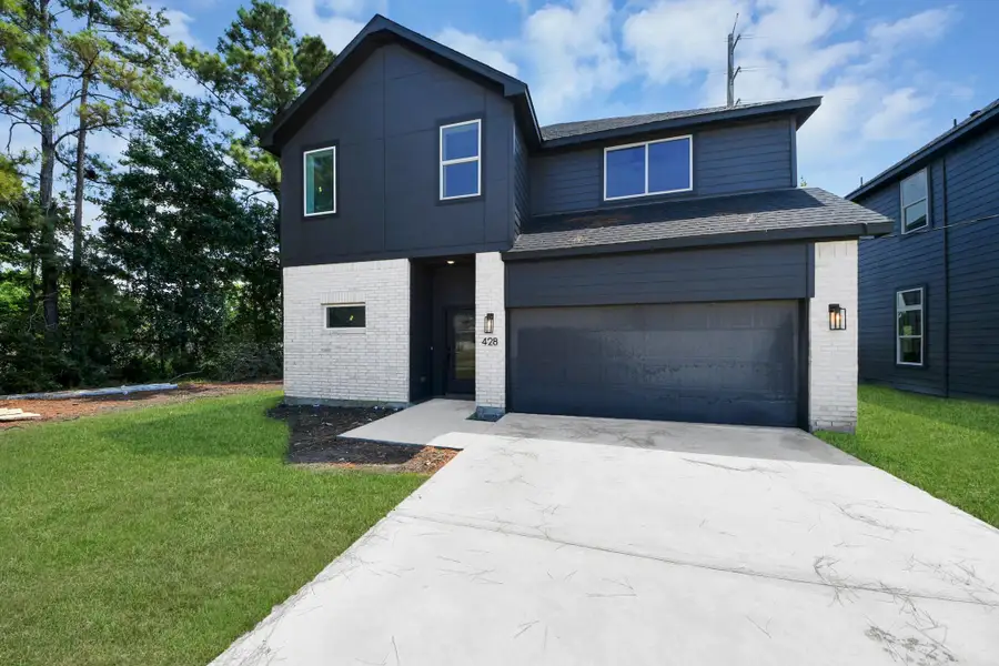 Front exterior of a new home in , Huffman, TX, highlighting curb appeal (Image 22).