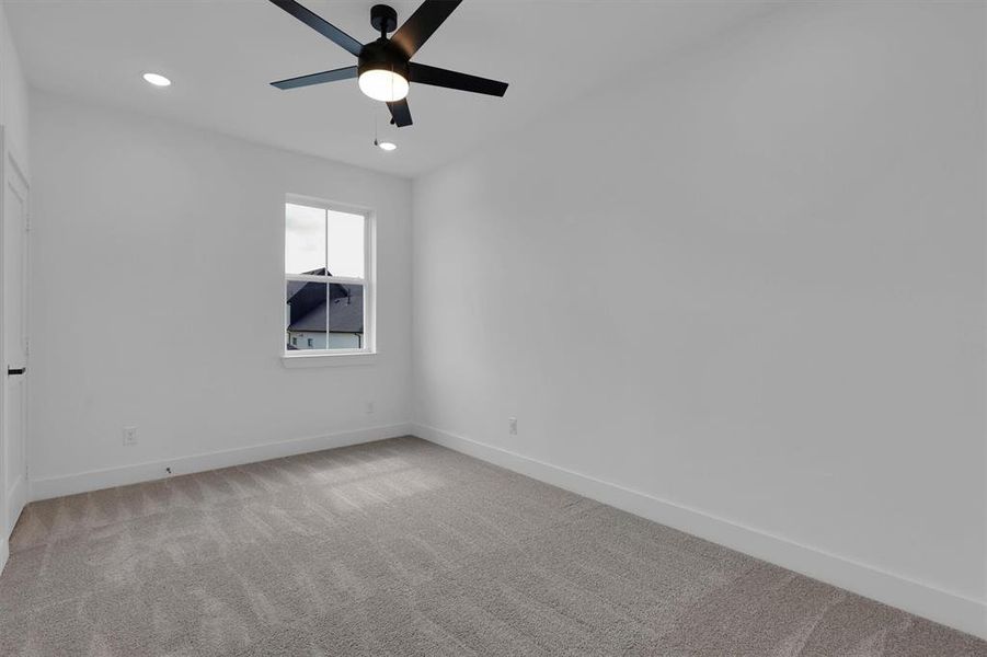 Empty room featuring ceiling fan, light colored carpet, and recessed lighting Empty room featuring ceiling fan, light colored carpet, and recessed lighting
