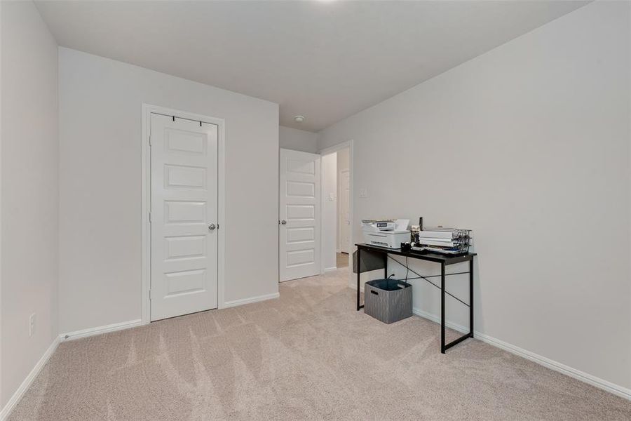Office featuring light colored carpet and baseboards Office featuring light colored carpet and baseboards